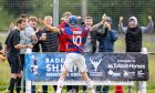 Kingussie's Liam Borthwick shares his goal celebrations with supporters. Image: Neil Paterson.