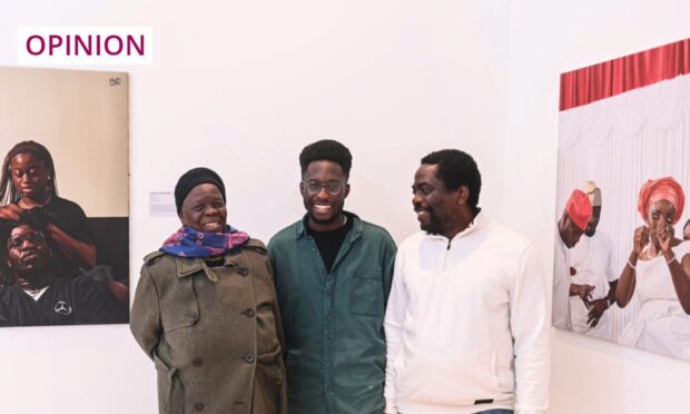 Artist Joshua Ekekwe (centre) has an exhibition of his work on display at Aberdeen's Music Hall called The Diaspora Everyday. Image: Darrell Benns/DC Thomson