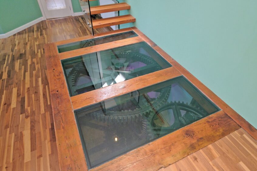 A view of the clogs showing through the glass flooring.