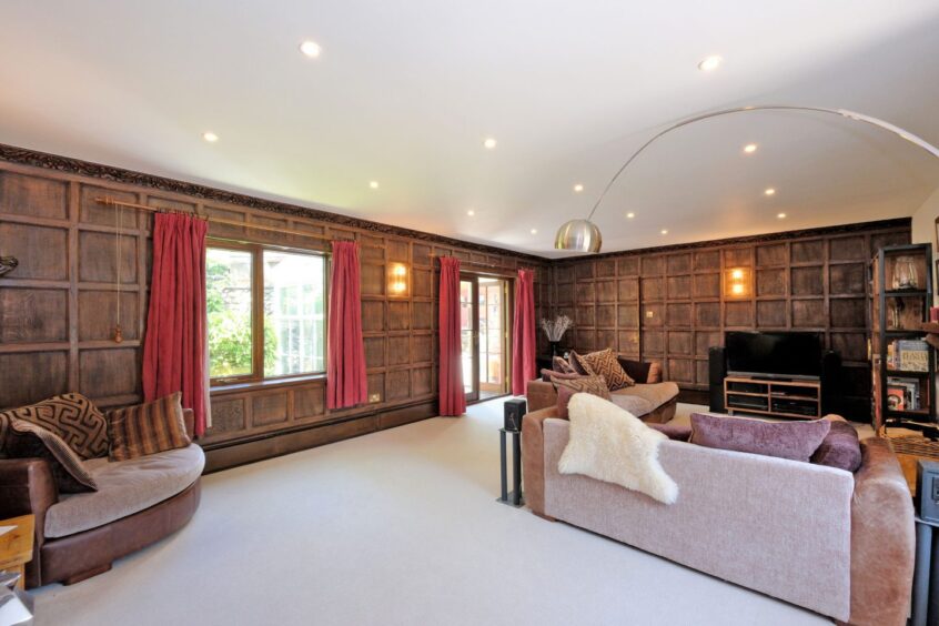 Lounge area with historic wood panelling inside the renovated Inverurie mill