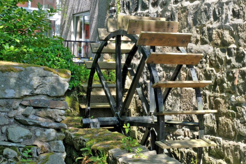 Historic water wheel outside the Inverurie property