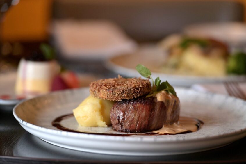 28 day-aged fillet of Highland beef on truffled mash, glazed root veg, breaded haggis and mustard sauce