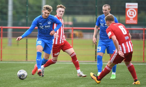 Peterhead's Kieran Shanks, left, goes on the attack, but is pursued by Aidan Combe of Formartine United, second from left. Pictures by Duncan Brown.