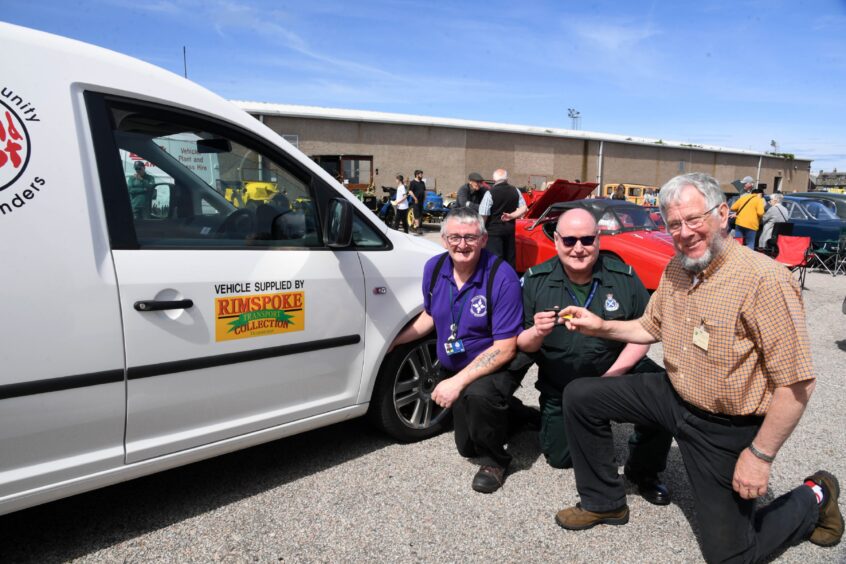 JAMES GRAY (R) OF THE RIMSPOKE TRANSPORT COLLECTION HANDS OVER THE KEYS OF A NEW VAN TO BROCH COMMUNITY FIRST RESPONDER DOUGLAS EWEN WATCHED BY FELLOW RESPONDER WILLIAM BOWIE.SINCE THE SERVICE WAS STARTED EIGHT YEARS AGO,THE TEAM OF ELEVEN VOLUNTEERS HAVE ATTENDED OVER 2500 CALLS, 240 THIS YEAR ALREADY AND COVERED THOUSANDS OF MILES THROUGHOUT THE BUCHAN AREA HELPING TO SAVE LIVES.
