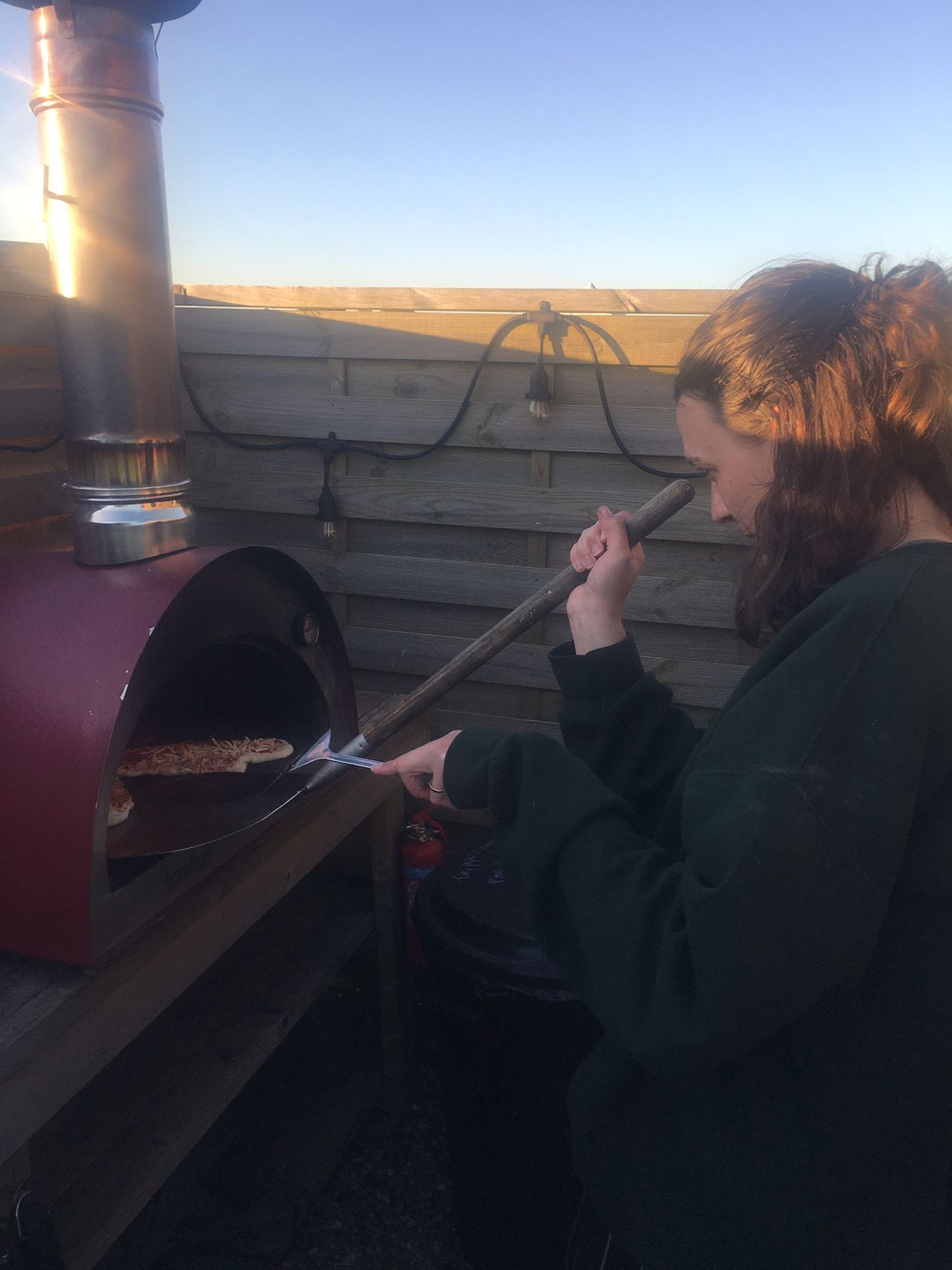 Lottie trying to cook pizza