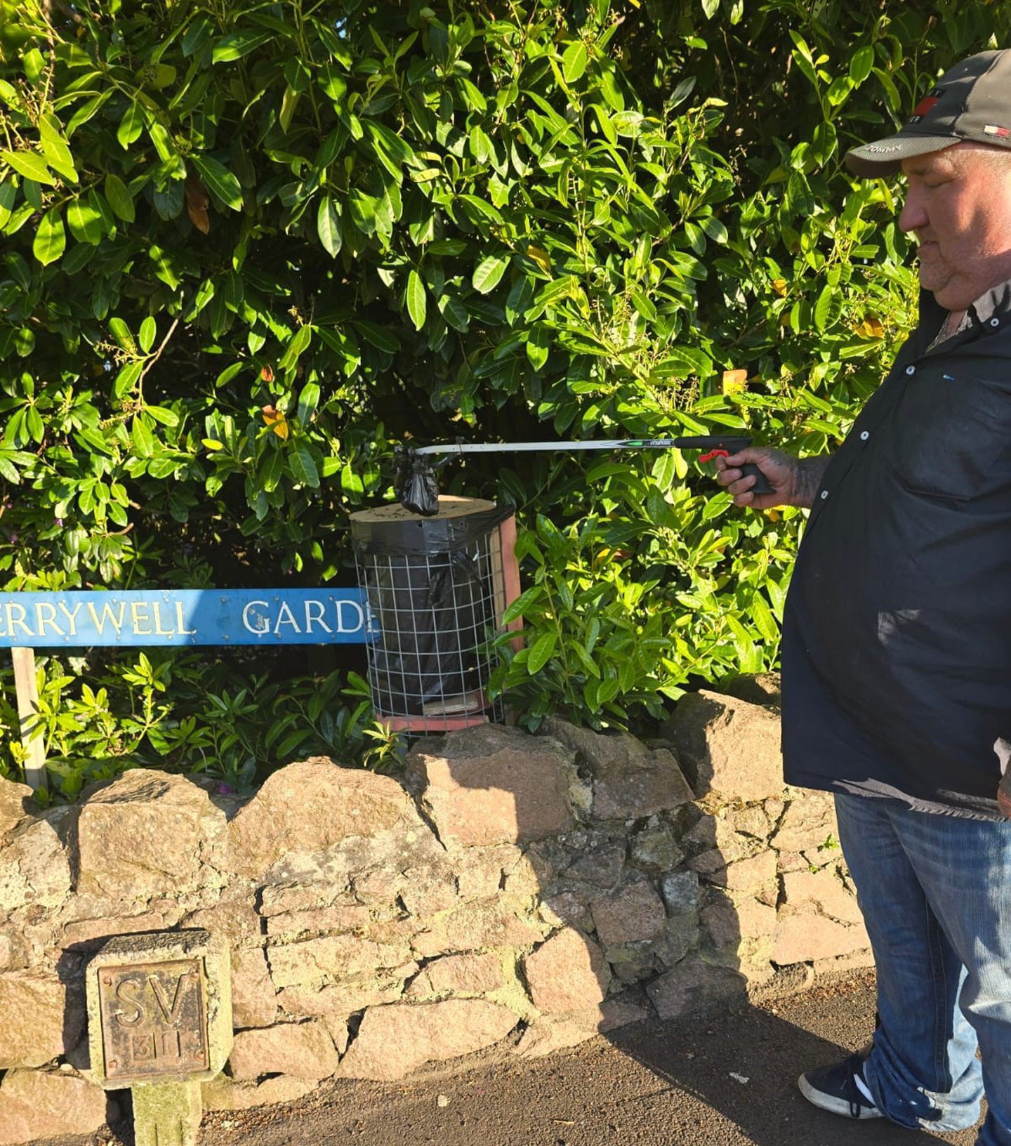 Gary Dow out helping clean up dog mess on the streets of Dyce and surrounding areas.