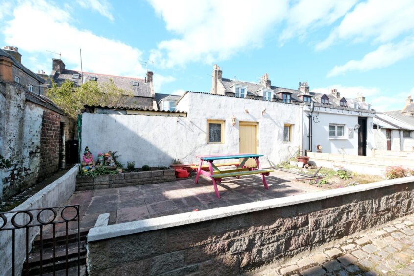 The walled garden area outside the house