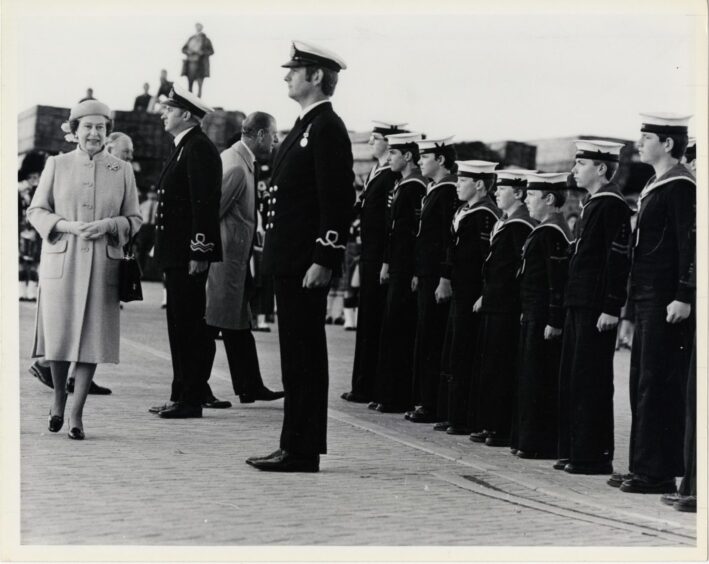 Queen Elizabeth inspects the Inverness Sea Cadets guard of honour in 1985. Prince Philip is in the background talking to a cadet.