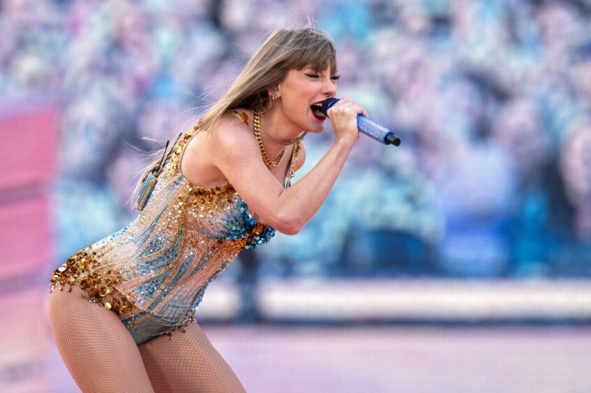 Taylor Swift performs on stage during her Eras Tour at Murrayfield Stadium in Edinburgh. 