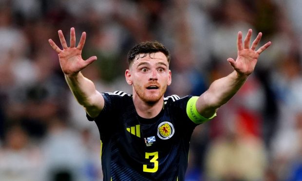 Scotland captain Andy Robertson and his team-mates were run ragged by Germany. Image: PA