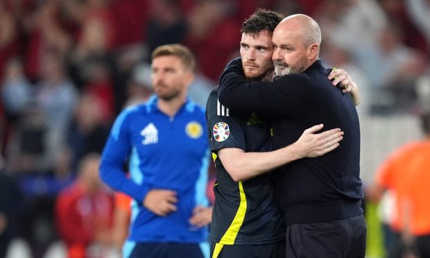 Scotland's Andrew Robertson and manager Steve Clarke react after exiting the tournament following the defeat by Hungary. Image: PA.