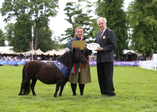 Sophie Robertson-Imrie with miniature Shetland champion Dryfesdale Martina and judge Hugh Duncan.