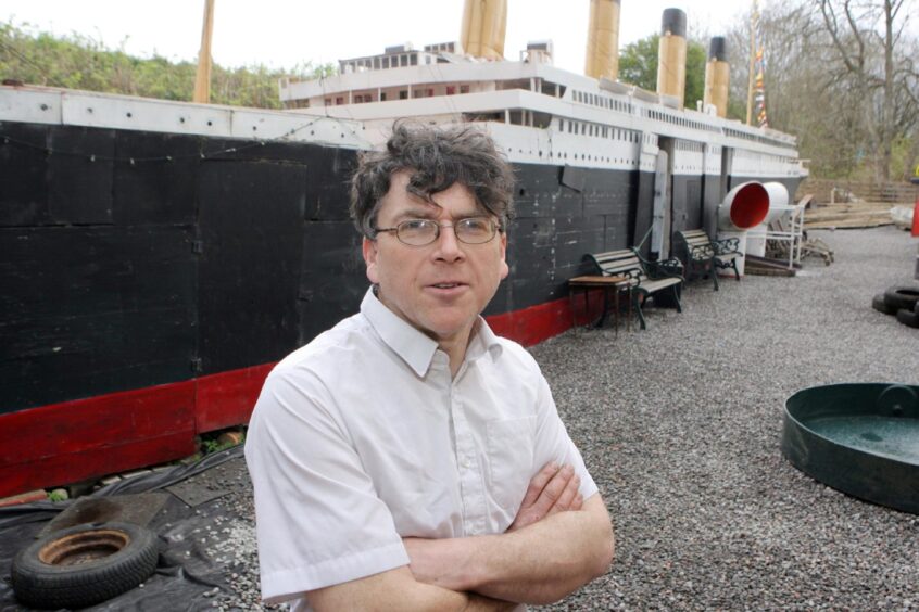 The late Stan Fraser with his model of RMS Titanic under construction behind him.