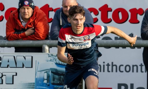 29 October 2022. Turriff United FC, The Haughs, Bridge of Turriff, Turriff, Scotland. This is from the Breedon Highland League Football Match between Turriff United FC and Brechin City FC. PICTURE CONTENT:- L - Callan Gray of Turriff and R - Marc Scott of Brechin