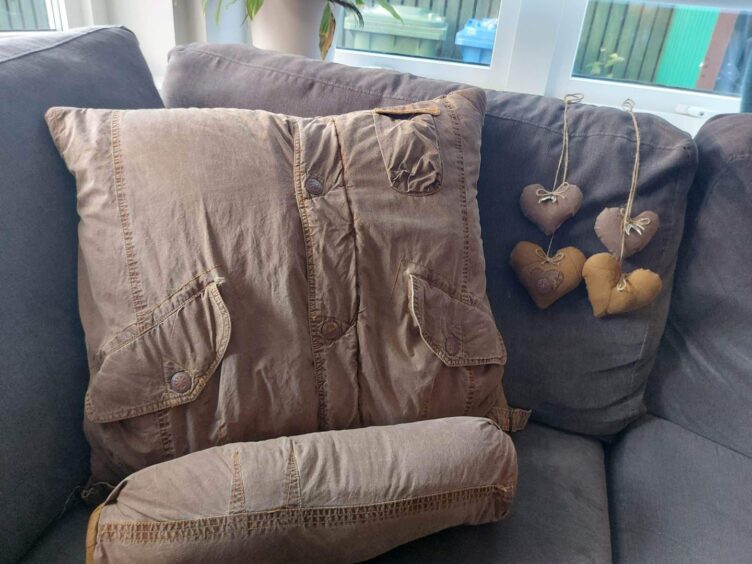 A cushion and loce heart made from jacket material.