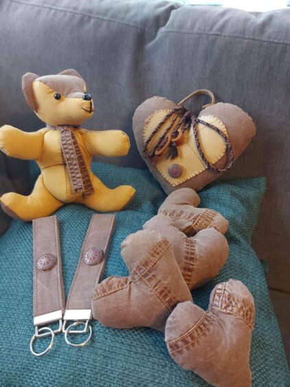 A bear, lovehearts created from yellow and brown material from a jacket.