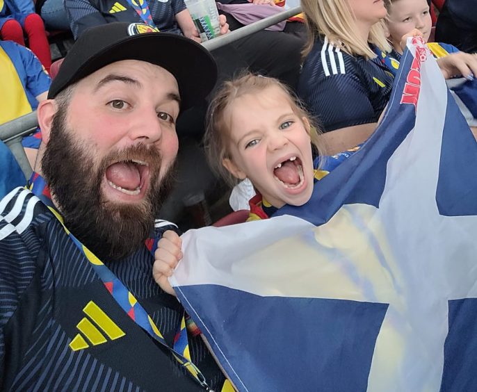 Annabella and her dad, Joe, at the Scotland game in Cologne