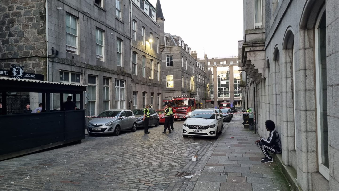 Police and fire crews at the scene of the fire on Stirling Street in Aberdeen city centre.