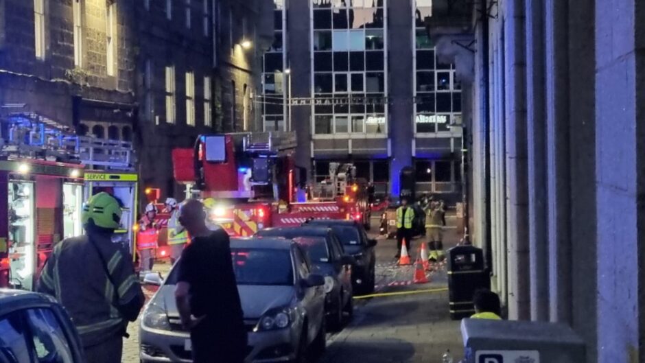 Several firefighters and police officers on Stirling Street in Aberdeen.