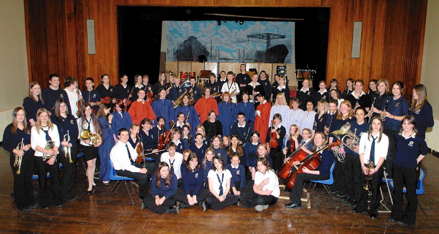 Inverurie Academy's Orchestra and Choir posing for photos