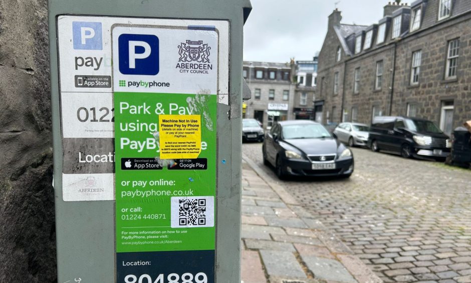 QR code scam sticker on a parking meter on George Street, Aberdeen.