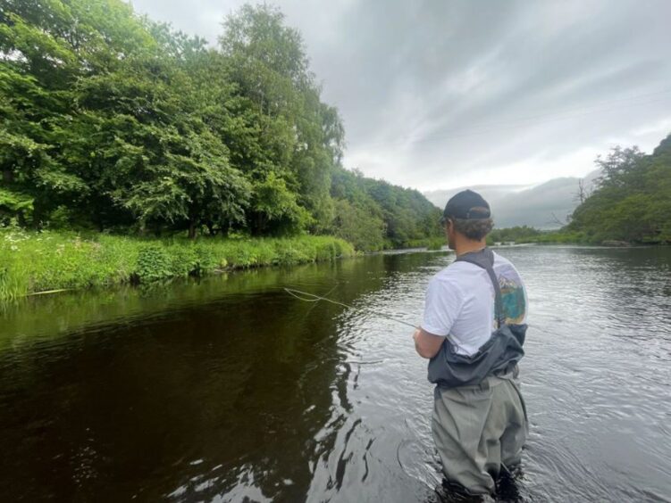 Sam Heughan on the River Deveron fly fishing.