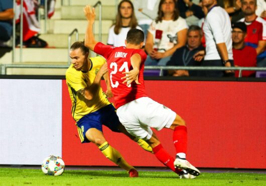 Niklas Hult, left, in action for Sweden. Image: Shutterstock.