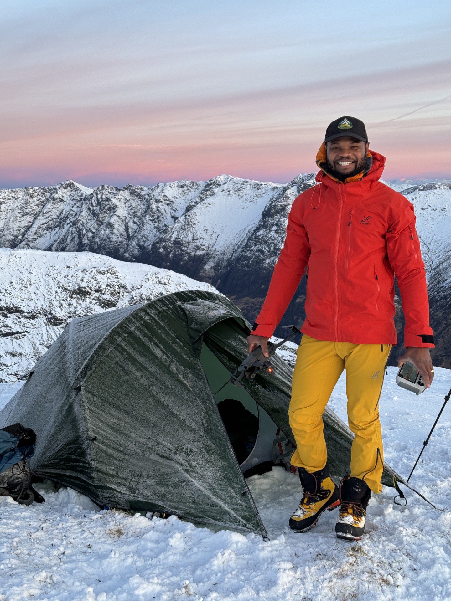 Josh Adeyemi camping in the snow.