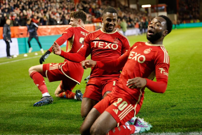 Dante Polvara, Duk and Shayden Morris celebrate the Dons taking the lead against Eintracht Frankfurt in the Conference League in 2023. Image: Shutterstock