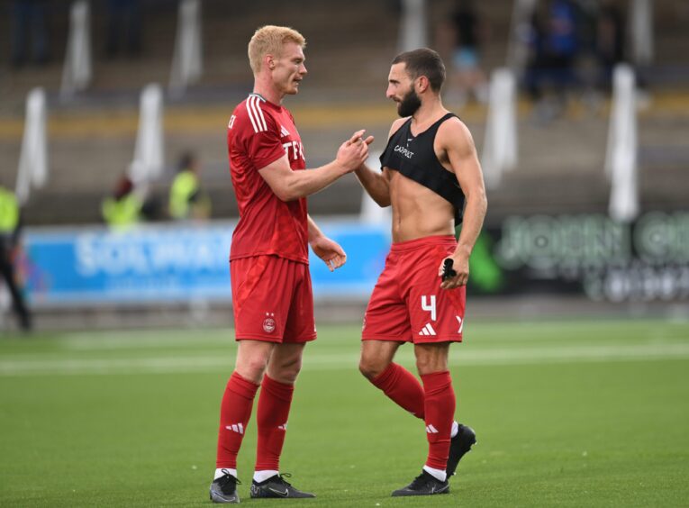 Sivert Heltne Nilsen of Aberdeen (left) and Graeme Shinnie after beating Queen of the South. 