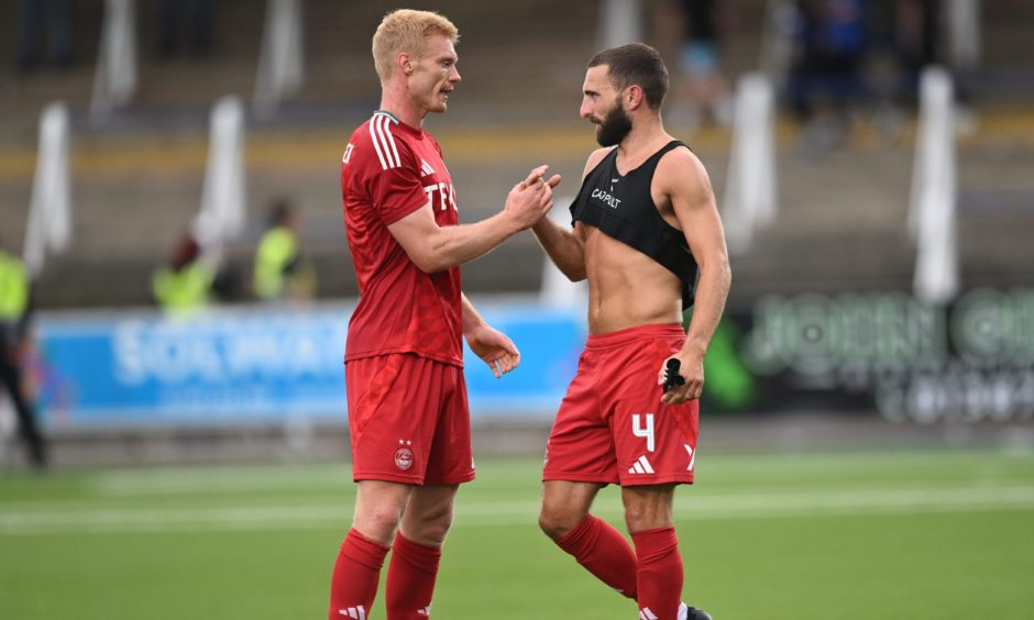 Sivert Heltne Nilsen of Aberdeen (left) and Graeme Shinnie after beating Queen of the South. Image: Shutterstock.