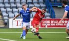 Graeme Shinnie of Aberdeen scores their second goal at
Queen of the South. Image: Shutterstock.