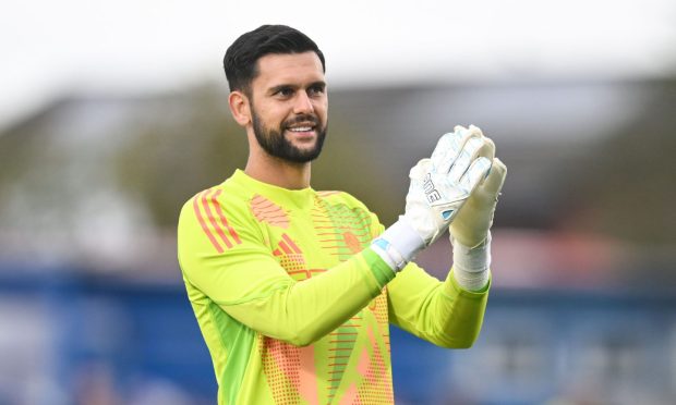 Keeper Dimitar Mitov during his Aberdeen competitive debut against Queen of the South. Image: Shutterstock