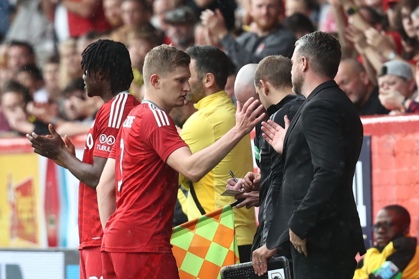 Aberdeen full-back Jack MacKenzie is substituted off and shakes hands with Aberdeen manager Jimmy Thelin during the 6-0 defeat of Dumbarton. Image: Shutterstock 