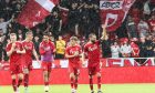 Graeme Shinnie and the Aberdeen players applaud the fans after the Premier Sports Cup match against Dumbarton.Image: Shutterstock.