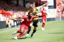 Shayden Morris in action for Aberdeen in their 6-0 win over Dumbarton. Image: Shutterstock.