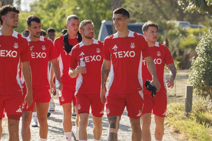 Aberdeen players arrive for a training session in Portugal.