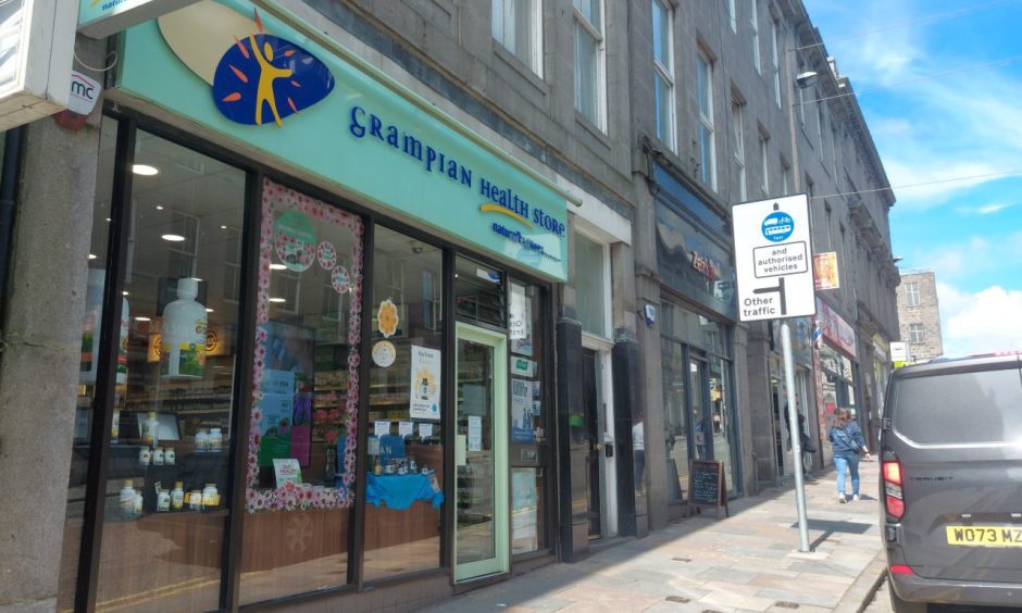 The front of the Grampian Health store on Market Street, where one of the bus gates is.