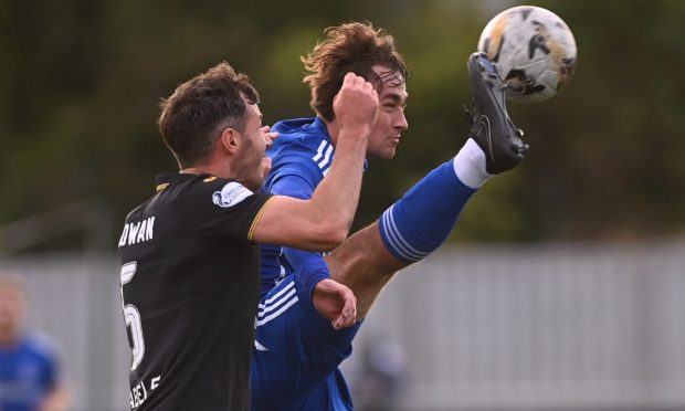 Cove Rangers striker Myles Gaffney stretches to get the ball before Ryan McGowan of Livingston. Image: Darrell Benns/ DC Thomson.