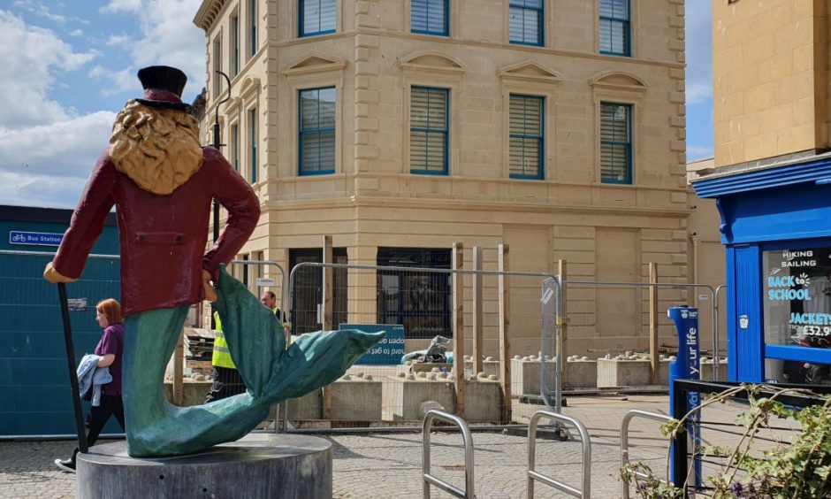 Dandy Lion with Poundland behind. 