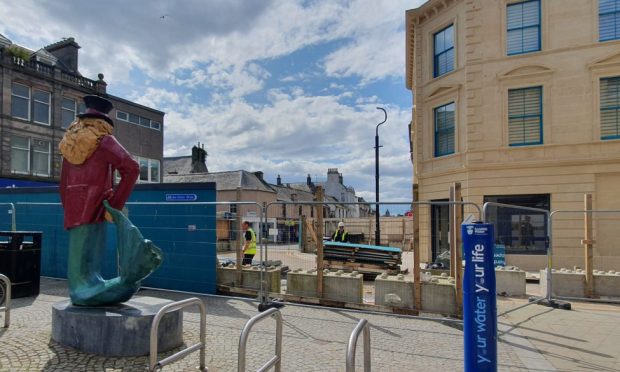 View of Dandy Lion and Poundland on Elgin High Street