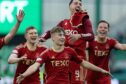 Aberdeen's Fletcher Boyd celebrates at full-time after scoring at Hibs. Image: SNS.