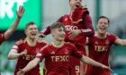 Aberdeen's Fletcher Boyd celebrates at full-time after scoring at Hibs. Image: SNS.