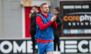 Inverness Caledonian Thistle striker Billy Mckay applauds the fans.