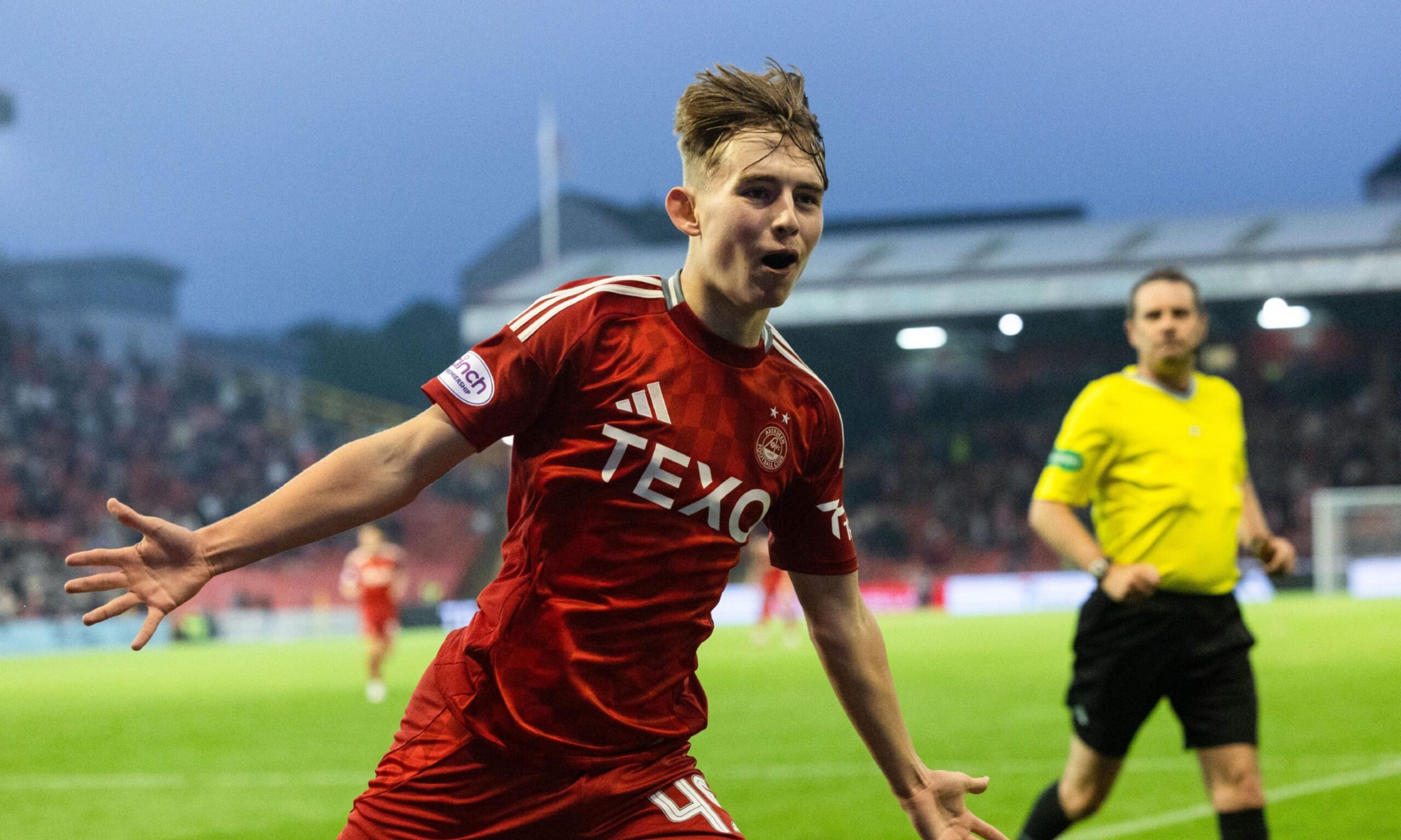 Aberdeen's Fletcher Boyd celebrates after scoring to make it 5-1 against Livingston. Image: SNS