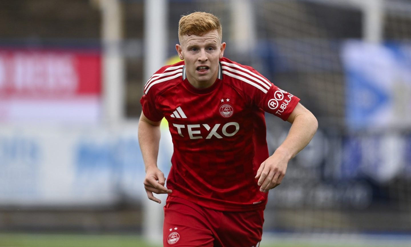 Aberdeen's Gavin Molloy makes his competitive debut in the Premier Sports Cup group stage match against Queen of the South. Image: SNS