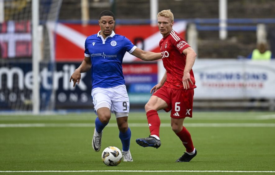 Aberdeen's Sivert Heltne Nilsen (R) and Queen of the South's Leighton McIntosh in action, Image: SNS