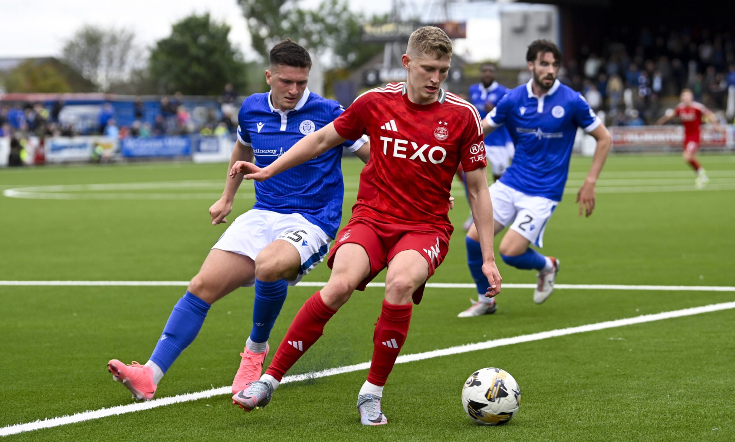 Aberdeen's Jack Mackenzie (R) and Queen of the South's Kyle Doherty during a Premier Sports Cup group stage match. Image: SNS 