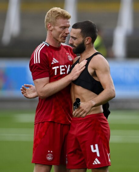 Aberdeen's Graeme Shinnie (R) and Sivert Heltne Nilsen at full time against Queen of the South. Image: SNS