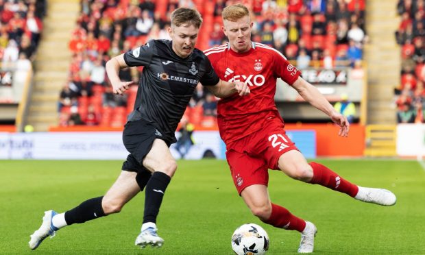 Aberdeen's Gavin Molly in action against Airdrie's Murray Aiken iduring a Premier Sports Cup group stage match. Image: SNS.